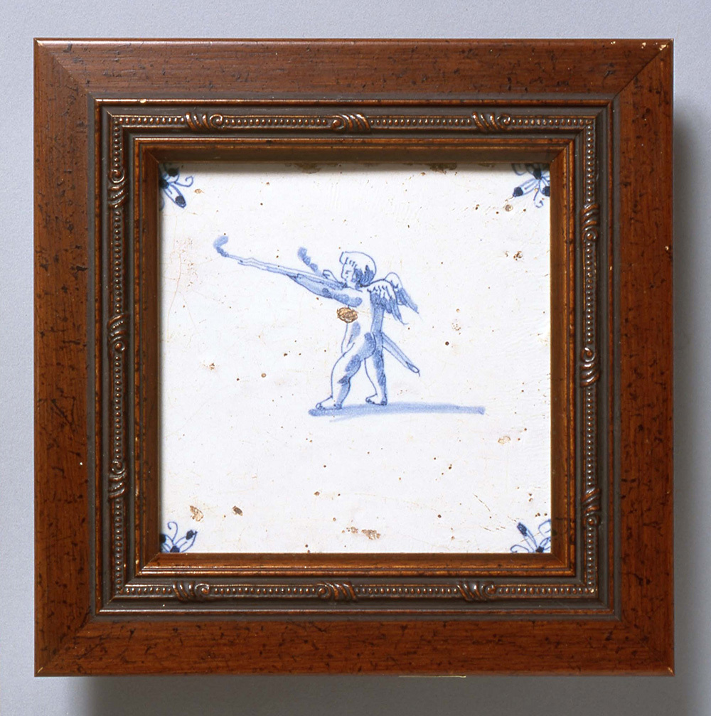 前述の幅木タイルと同じ “子どもの遊び”モチーフのオランダタイル(写真提供:INAXライブミュージアム)